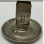 A WWII style Waffen SS match box holder on an ashtray base.