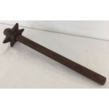 A WWII style British trench mace with a wooden handle.