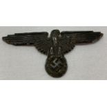 A German WWII style Waffen SS eagle cap badge, with folding lug fixings to reverse.