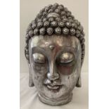 A large modern ornamental silver coloured resin Buddha head.