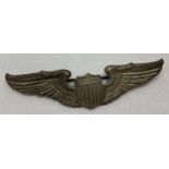 A WWII style pilots wings, pin backed badge.
