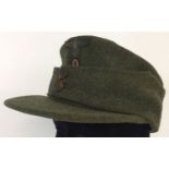 A WWII style German army M42 field/ski cap. With early button design.