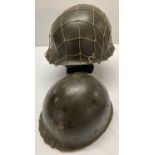 A WWII style US M1 helmet with captains bars. Front split seam, swivel bale (both loops missing).