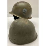 A WWII style US M1 36th Infantry helmet with hand painted insignia.