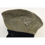 A WWII style SS-VT officer's side cap with German eagle cloth badge to side.