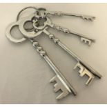 A modern ornamental bunch of large metal keys.