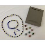 A matching glass bead necklace, bracelet and drop earring set. Earrings marked 925.