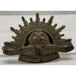 A WWI style Australian A.N.Z.A.C. rising sun hat badge.