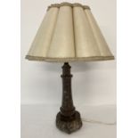 An early 20th century Cornish serpentine lighthouse shaped table lamp with original period shade.