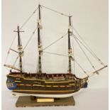 A handmade wooden scale model of a 18th century 32 gun frigate. With detailed masts, sails and body.