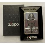 An erotic design boxed zippo lighter with inscription to back "Keep Safe Covid 19 2020".