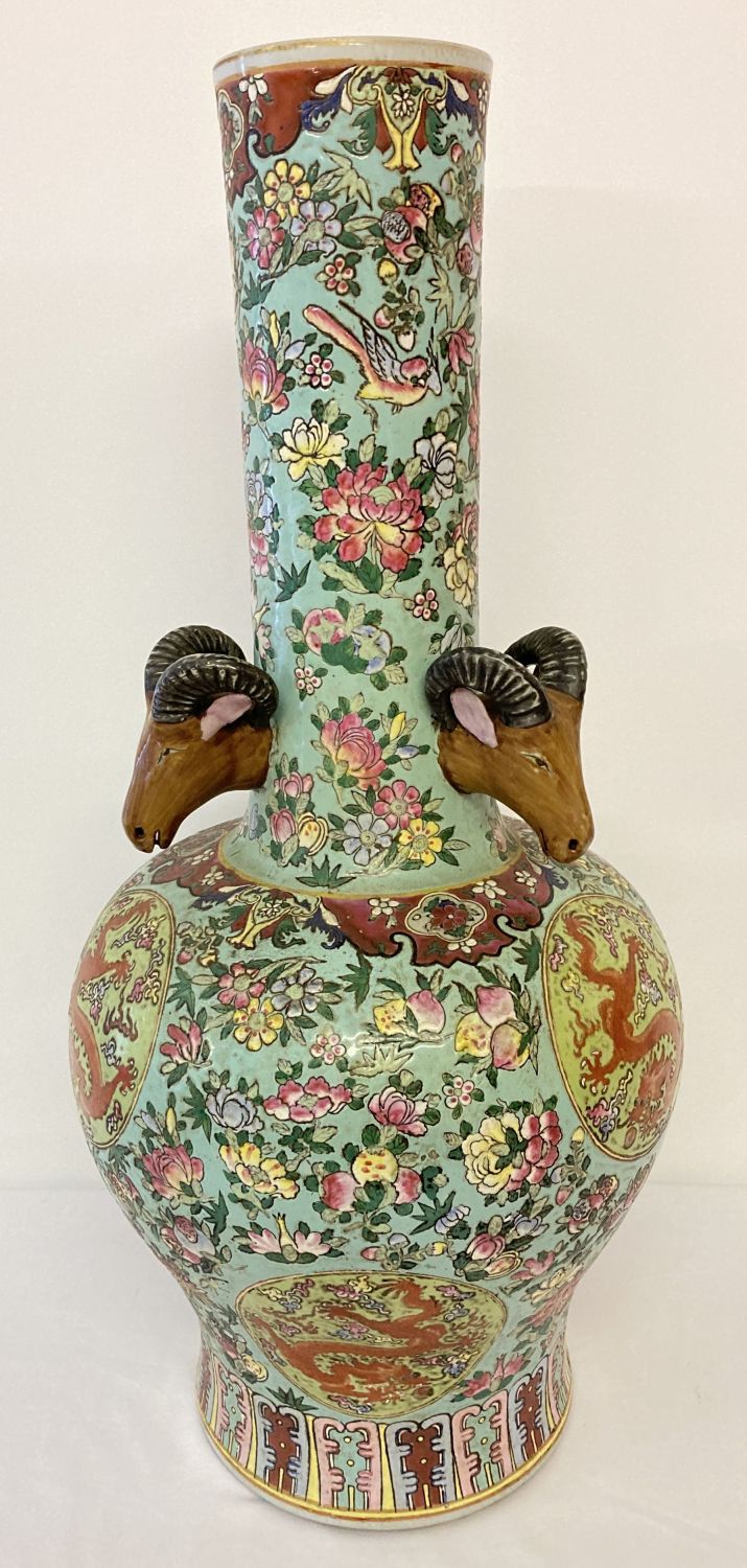 A very large ceramic long necked vase, decorated with peaches, birds and floral design.