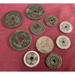 A collection of 10 assorted Chinese coins and tokens to include several with square shaped holes.