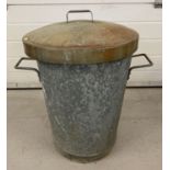 A vintage galvanised 2 handled dustbin with lid.