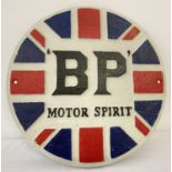 A Circular painted cast iron "B.P. Motor Spirit" wall hanging plaque.