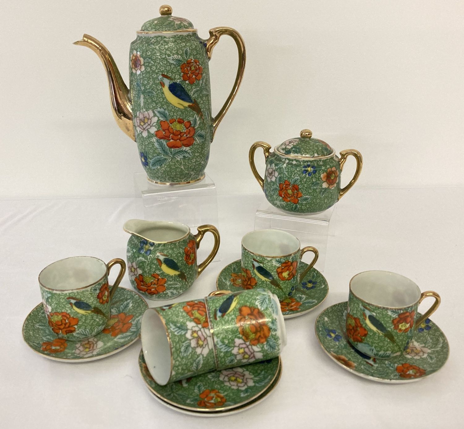 A vintage Japanese 13 piece coffee set with floral and bird detail.