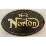 An oval shaped, painted cast metal, Norton wall hanging plaque.
