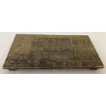 A large Chinese brass rectangular shaped scroll weight with Chinese symbol detailing to top.