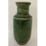 A dark green glazed ceramic vase.