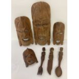 A collection of African carved wooden tribal items.