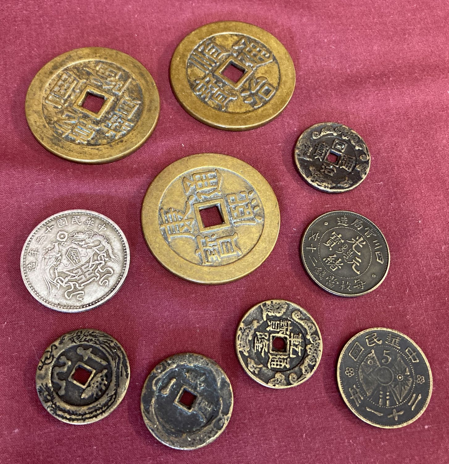 A collection of 10 Chinese coins to include Ban Liang style coins with central square shaped hole.