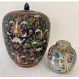 2 Oriental ceramic lidded jars with hand painted detail.
