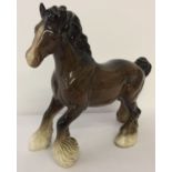 A Beswick ceramic Cantering Shire horse, in brown gloss finish.