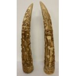 A pair of highly carved resin faux tusks depicting Oriental Deities.