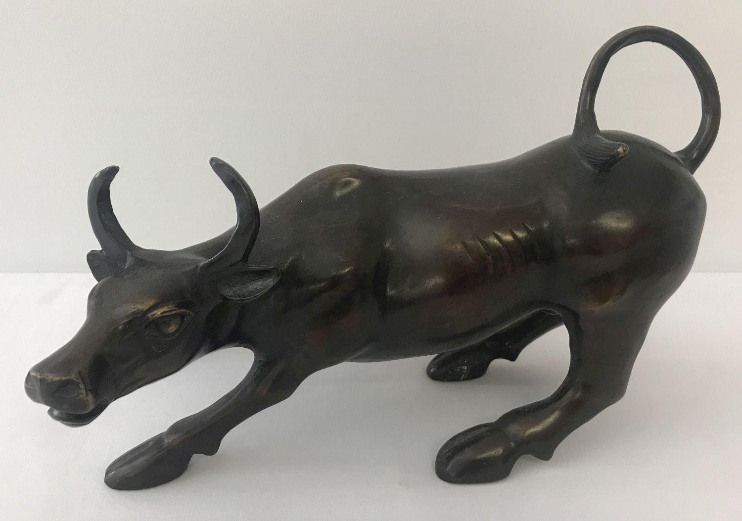 A hollow bronze figurine of a bull.