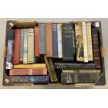 A box of vintage books relating to world travel.