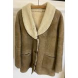 A vintage ladies sheepskin jacket. Fleece lining and collar, button front with two front pockets.