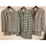 3 vintage skirt suits in check patterns. A fine dog tooth check in pale green and blue by Windsmoor.