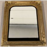 A modern mirror within a decorative vintage gilt frame. A/f.
