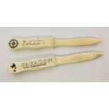 2 bone letter openers with carved detail to handles.