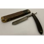 A vintage Carl Rader Solinge cut throat razor with partial original box.