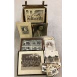 A box of framed and glazed and loose vintage photographs of family portraits, military and animals.