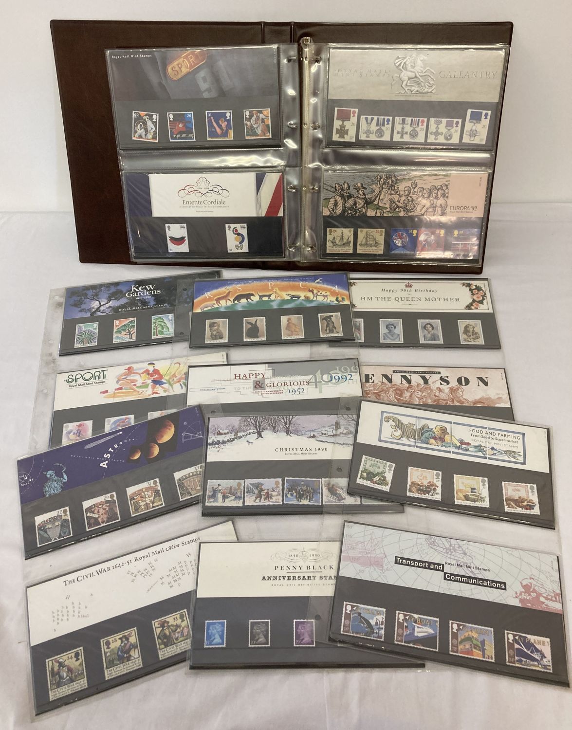 An album containing a quantity of assorted Royal Mail Mint stamp presentation packs.