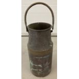 A vintage copper milk churn with brass banding and carry handle.