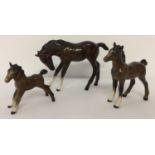 1 Royal Doulton and 2 Beswick ceramic horse foal figurines, in brown gloss finish.