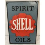 A Shell painted cast iron wall plaque with fixing holes.