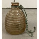 A vintage glass wasp trap, carry handle missing.