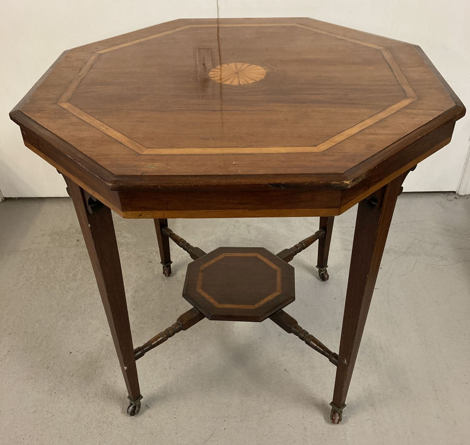 An Edwardian hexagonal occasional table with inlay detail to top.