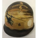 A Vietnam War era US MI helmet with post war 101st Airborne memorial hand painted detail.
