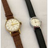 2 ladies vintage wristwatches. A Excalibur with white dial and gold tone hands and hour markers.