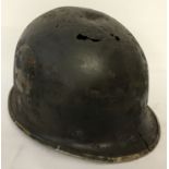 A WWII style relic US M2 paratroopers "D" bale helmet with remains of 101st Airborne markings.