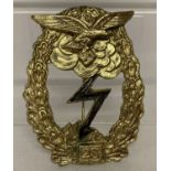 A WWII style German Luftwaffe 25 assults badge.