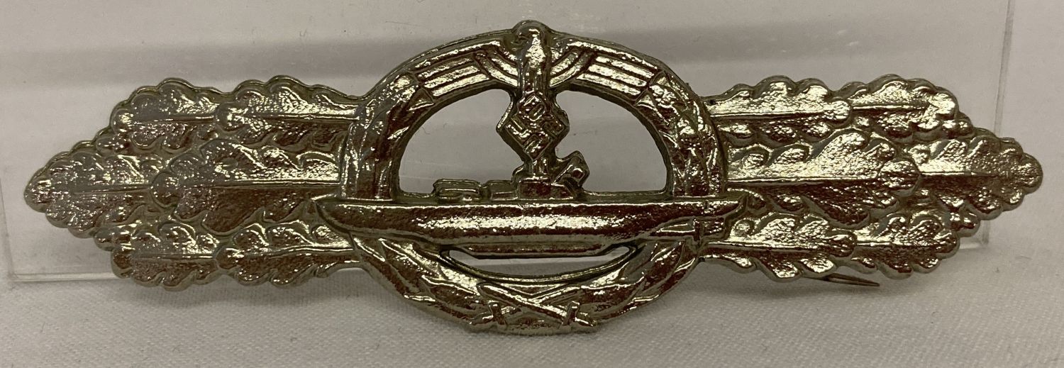 A WWII style German Kreigsmarine submarine front clasp badge.