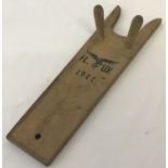 A German WWII Luftwaffe wooden boot beetle with printed logo and date to underside.