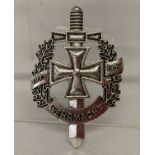 A WWII style German Wehrmacht service pin back badge.