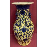 A 19th century blue and yellow Chinese vase with Chilong and Shishi decoration.
